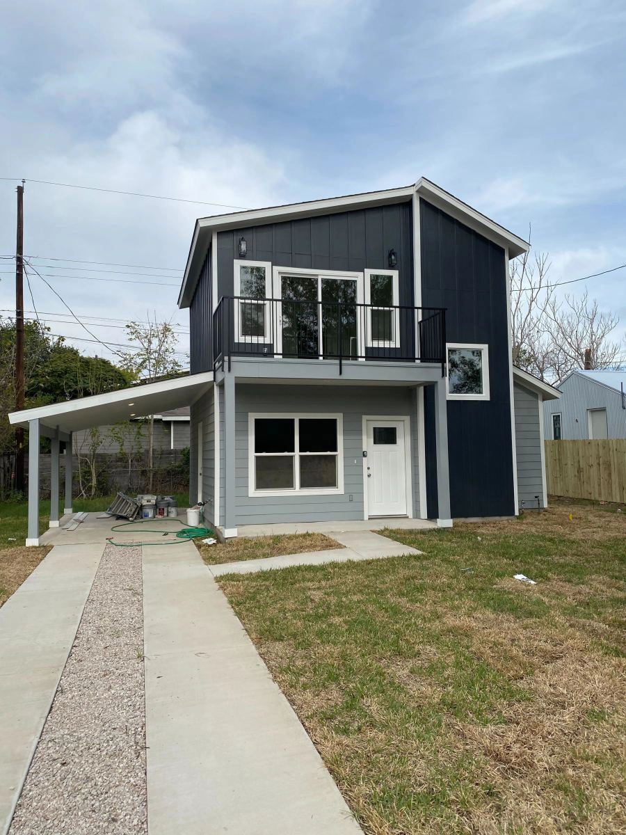 Hogan ADU with overhead electric lines, exterior equipment, yard access, and service-route context